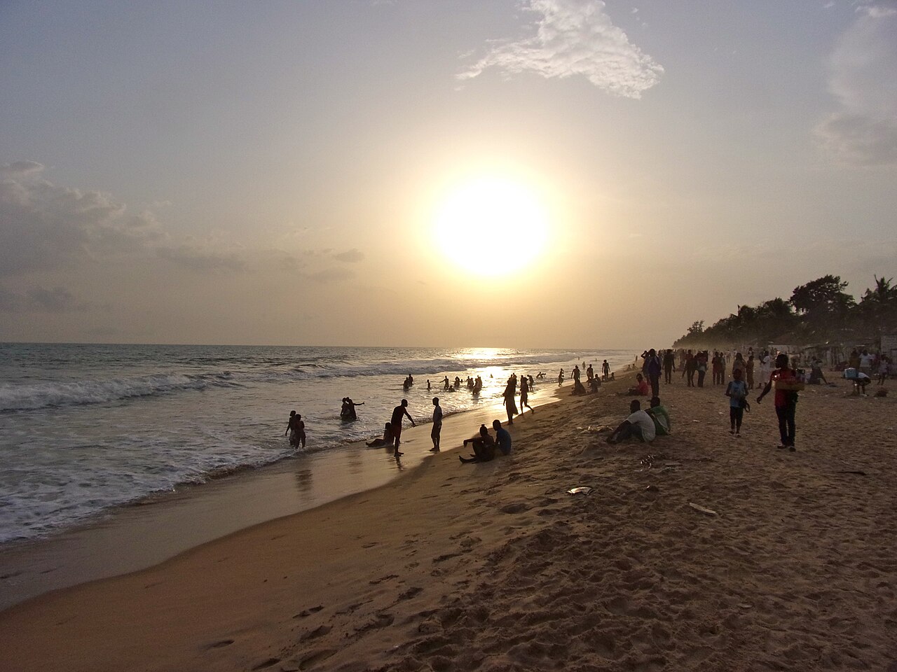 Beach with palm trees and fishing boats
