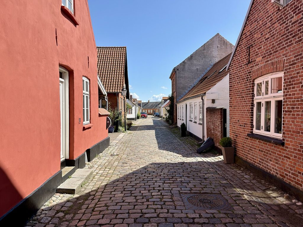 A cobbled street of colorful old houses