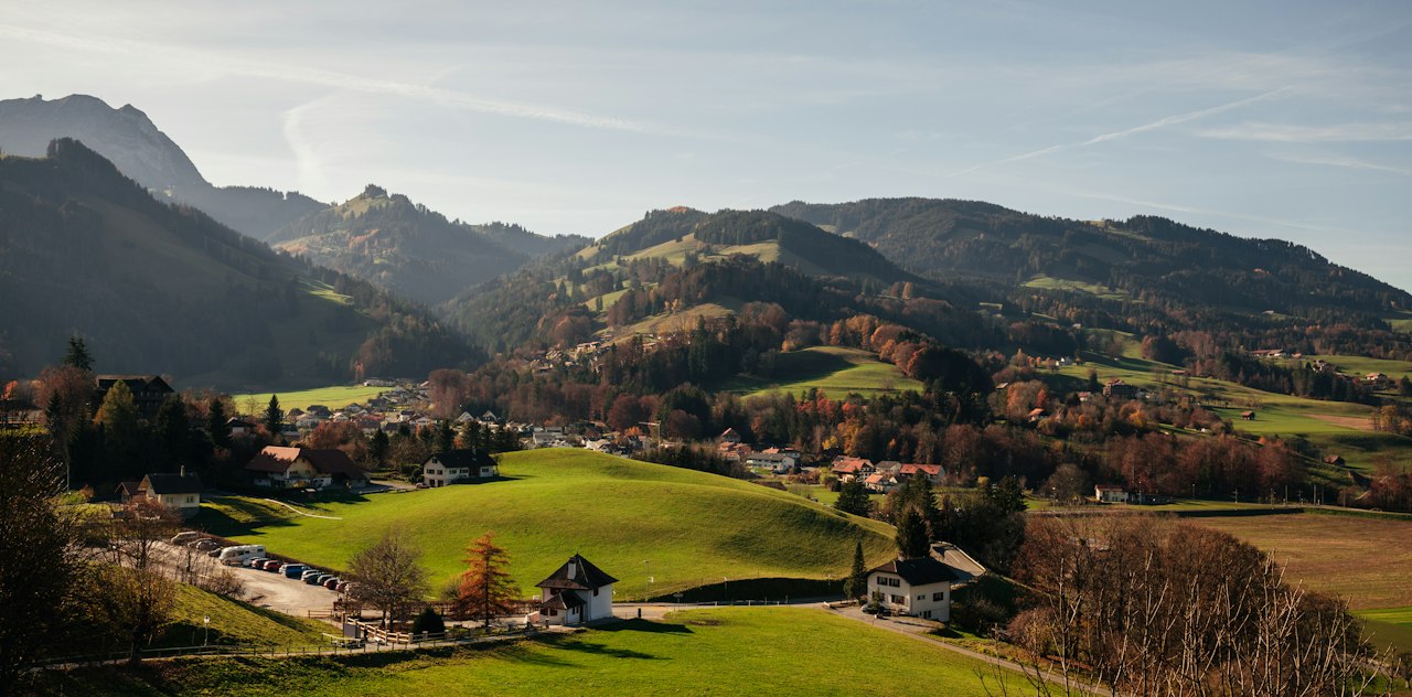 Green pastures and mountains around the village