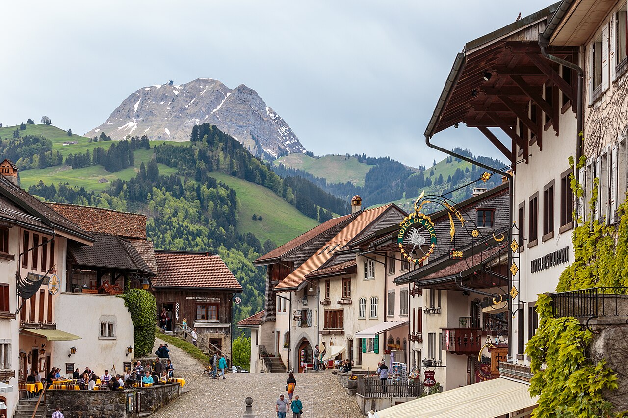 Cobbled main street with the Moléson peak behind