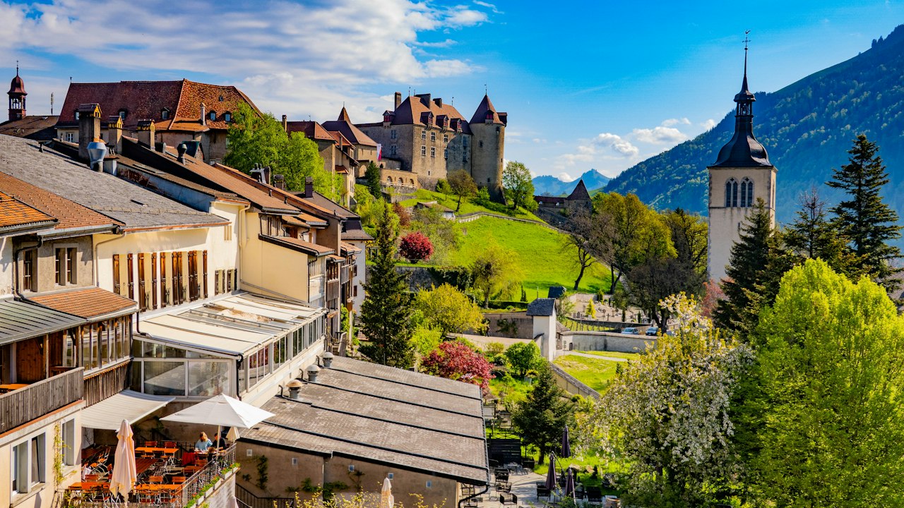 Gruyères Switzerland castle town on a green hill