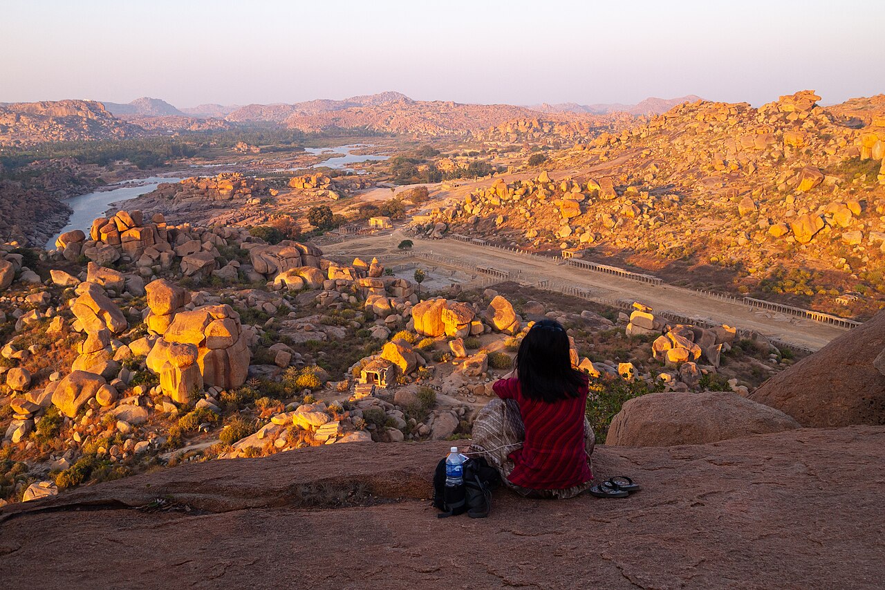 Granite boulders, palm groves and ruins seen from Matanga Hill