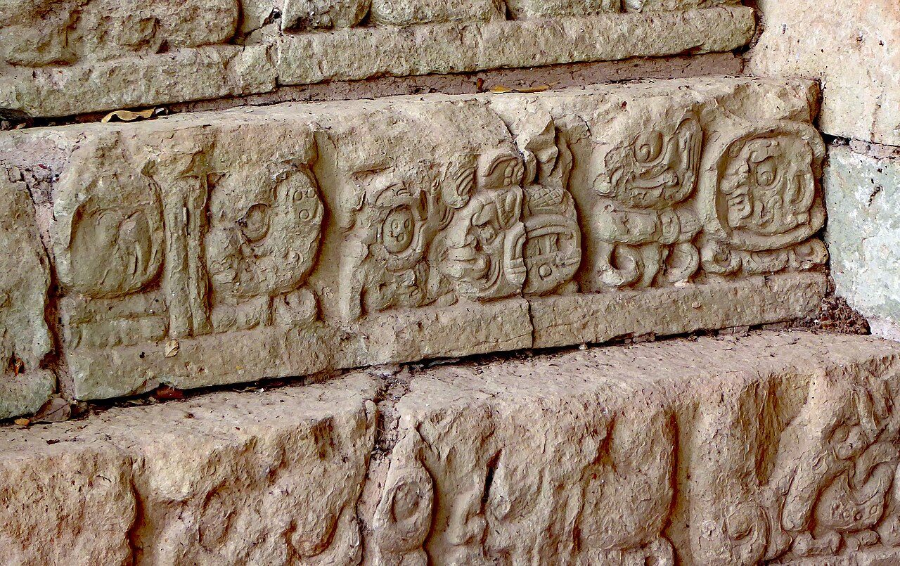 Carved Maya glyphs on the Hieroglyphic Stairway at Copan Ruinas
