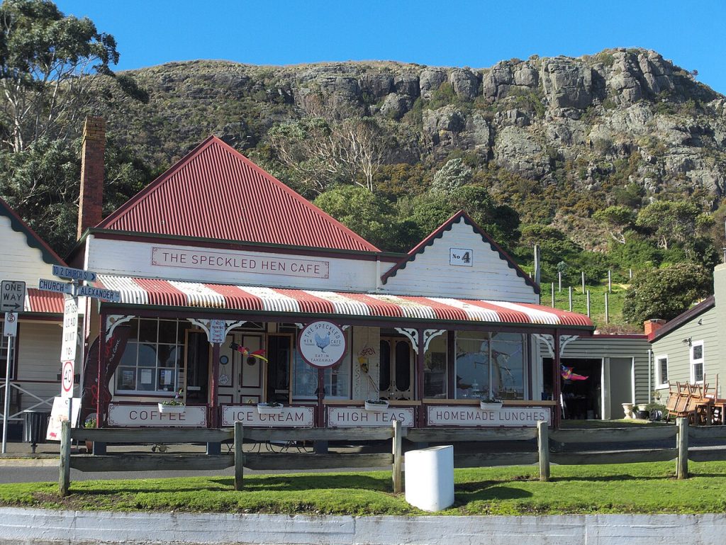 Historic weatherboard shopfronts with striped awnings