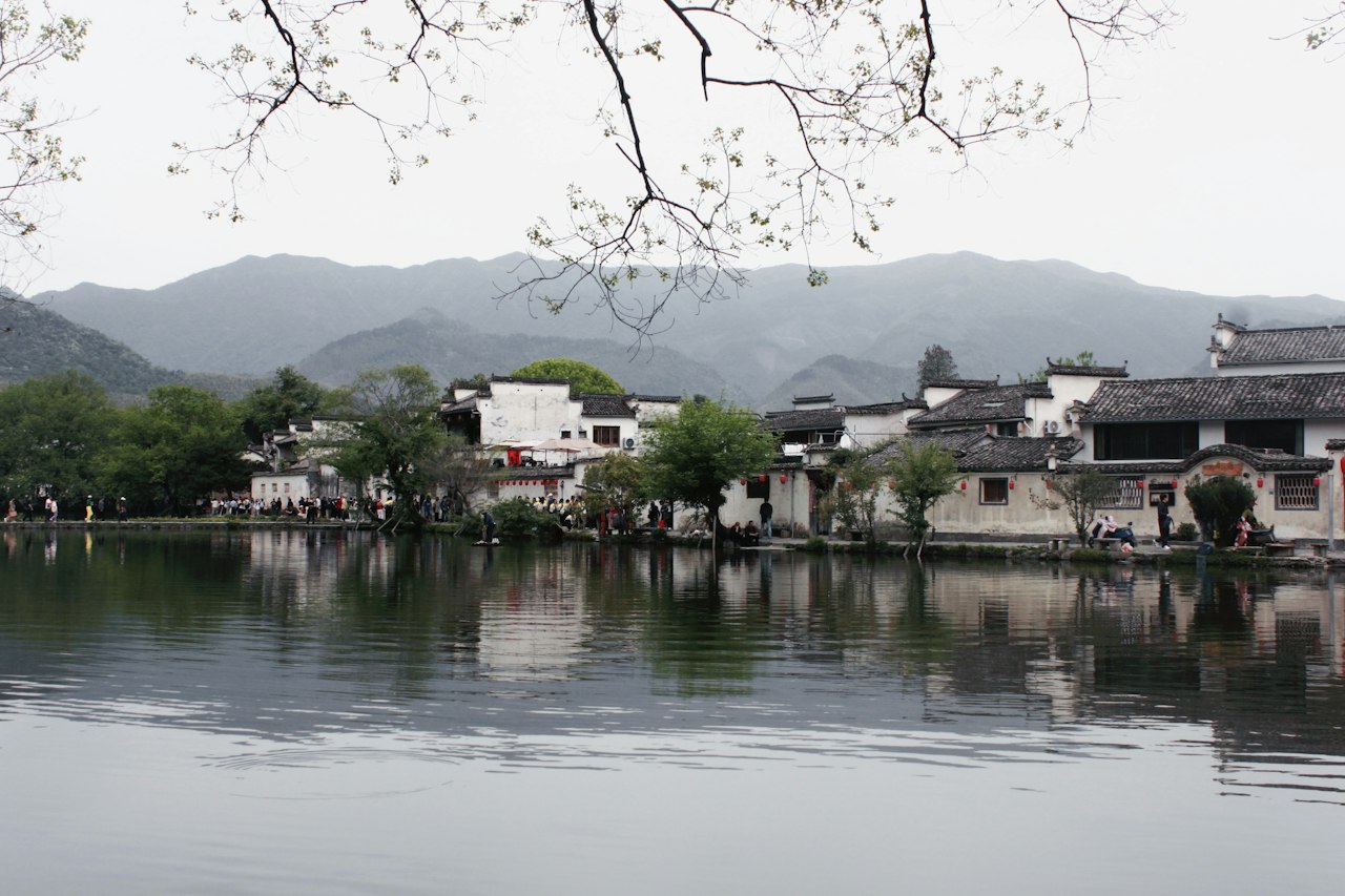 Hongcun Village white houses reflected in still water