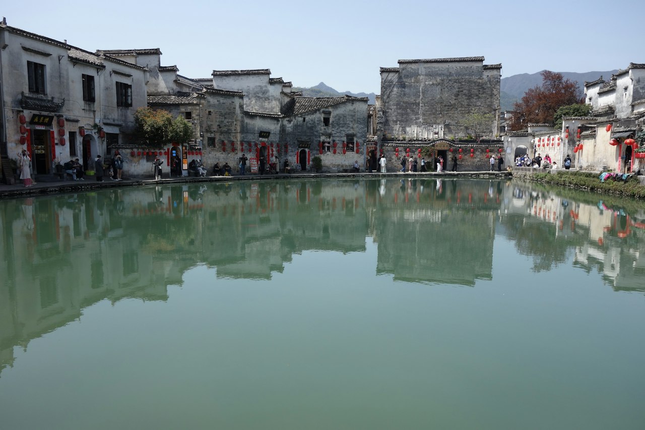 Hongcun Village rooftops reflecting in a pond