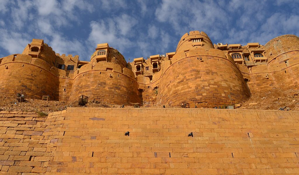 Rounded yellow sandstone bastions of the fort walls