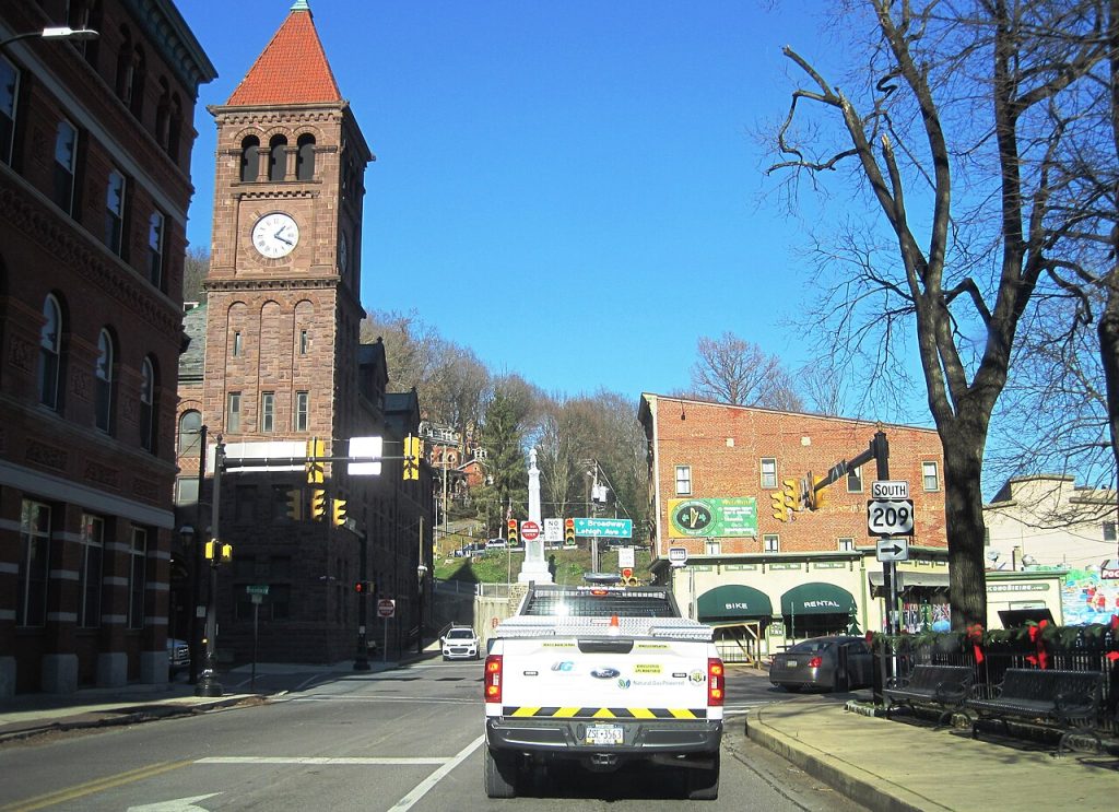 Jim Thorpe Pennsylvania Broadway with historic buildings and wooded mountains