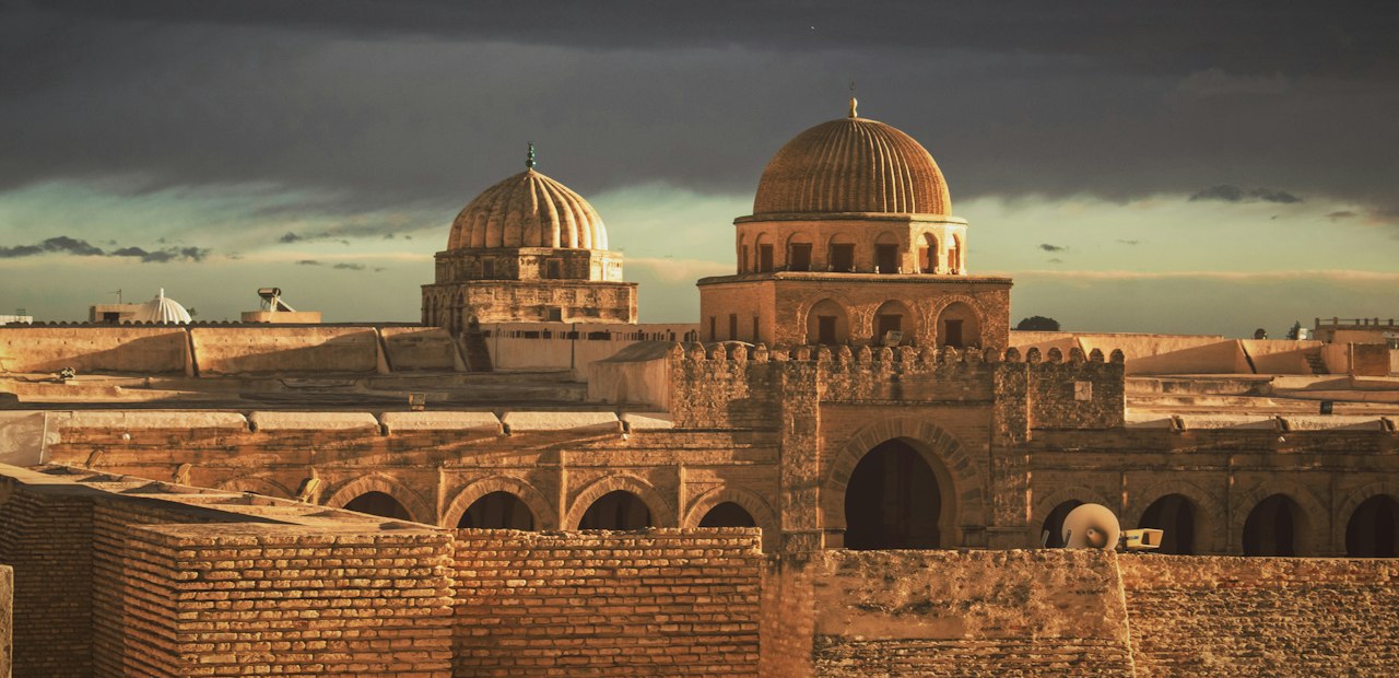 Domed building with ochre walls in the old city