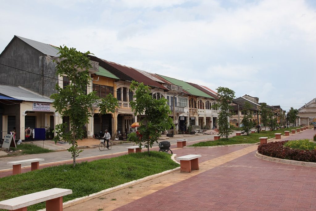 French colonial shophouses lining a quiet street in Kampot old town