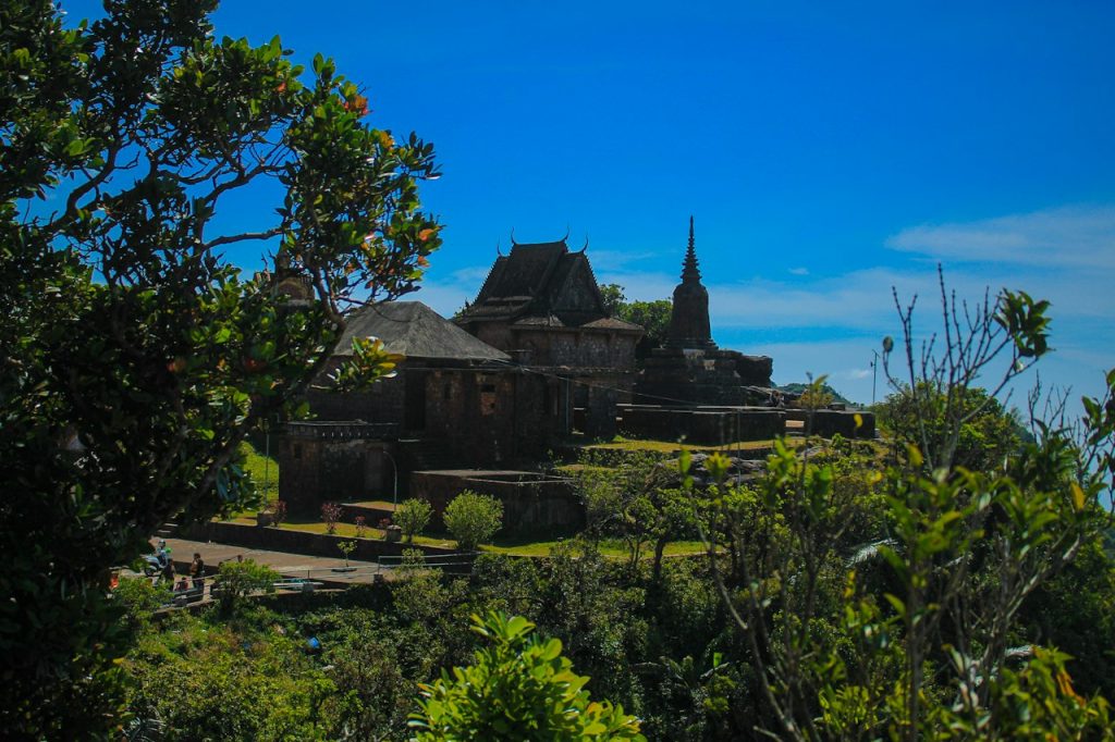 A pagoda on a green hillside in the countryside