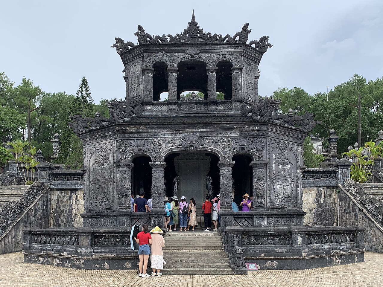Grey stone mausoleum on a hillside