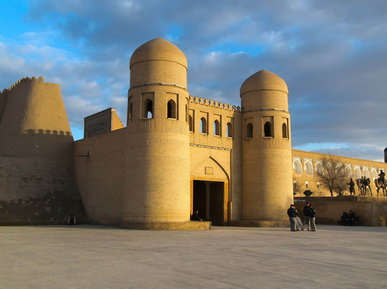 Fortress gate with two towers under a blue sky