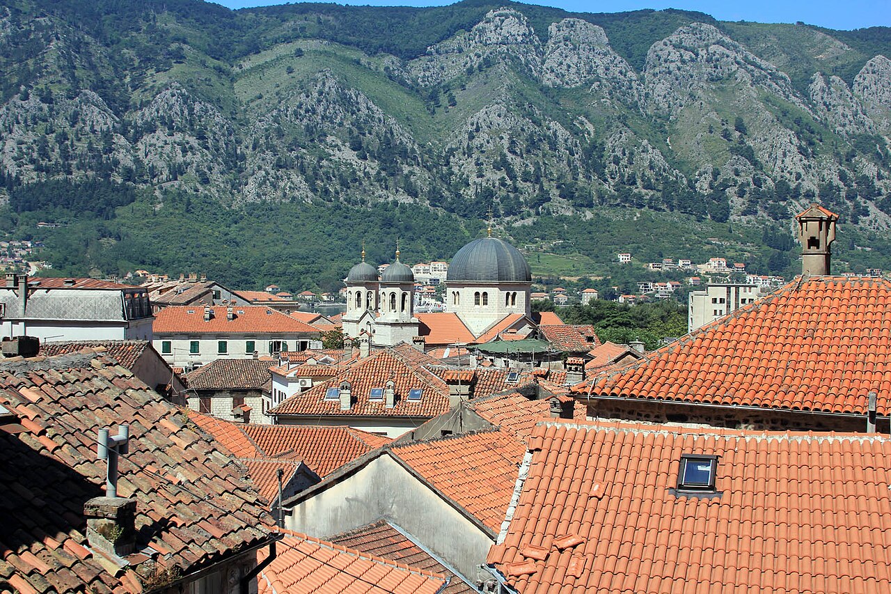 Red tiled rooftops and church bell towers inside Kotor old town