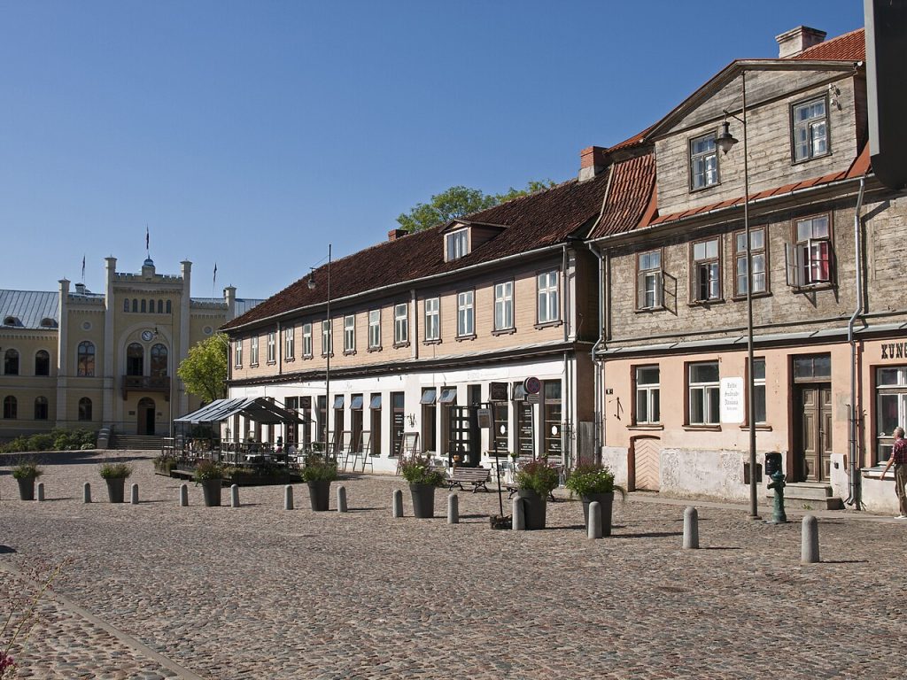 Historic red-roofed buildings along an old town street
