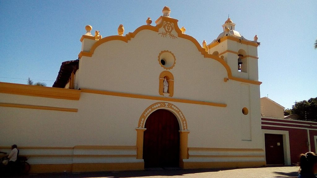 The white and yellow La Merced church