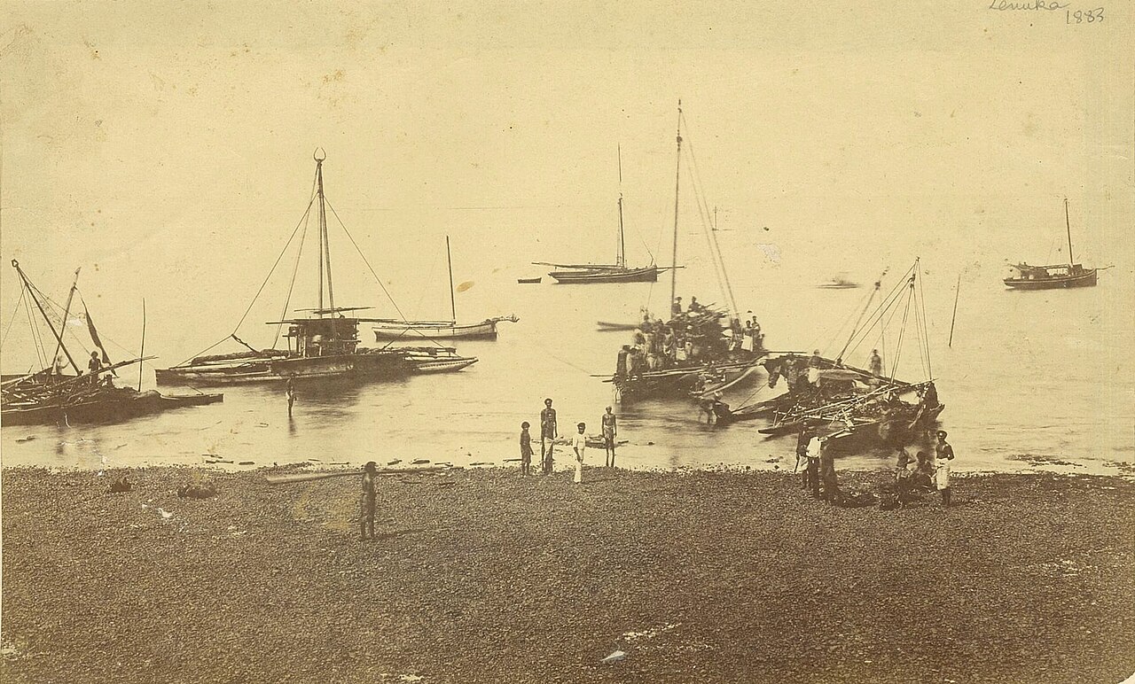 Historic photograph of the harbor and town around 1883