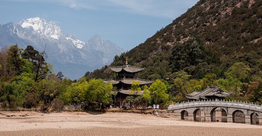 Black Dragon Pool with a pavilion and snowy peak near Lijiang Old Town