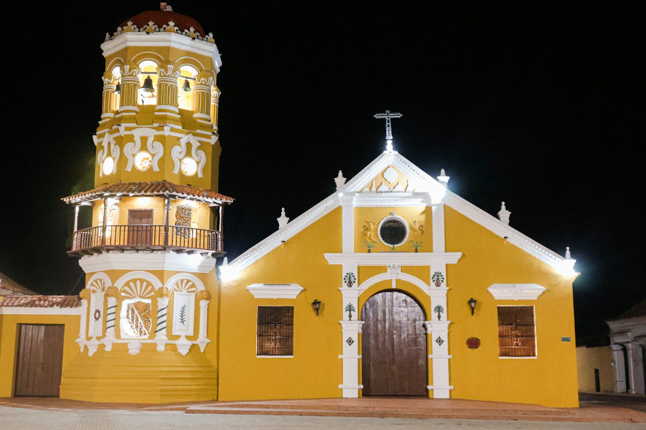 Yellow Santa Bárbara church in Mompox Colombia at night