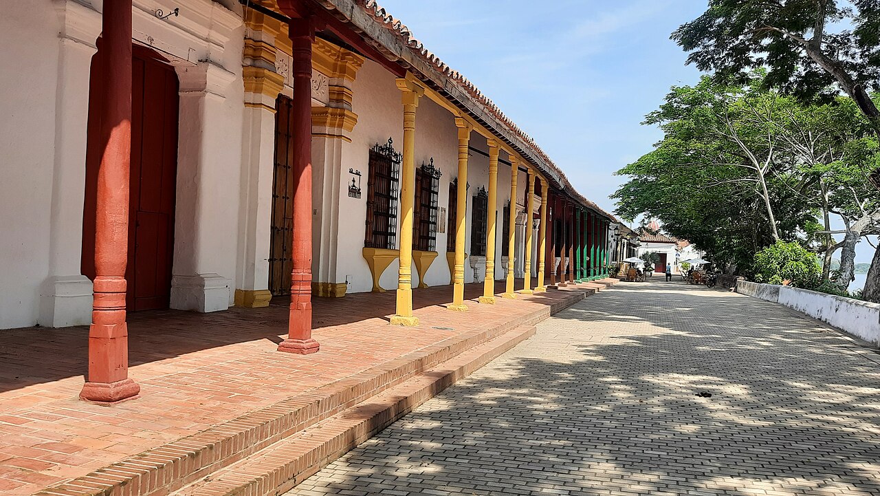 Pedestrian riverfront promenade with trees