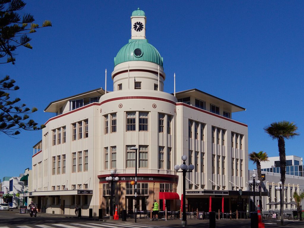 Napier New Zealand Art Deco building with a domed corner tower under blue sky