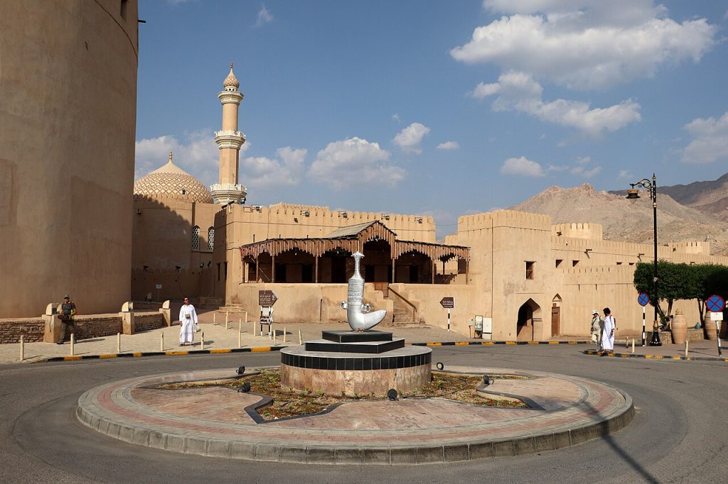 Square beside the souq with the fort and a mosque minaret