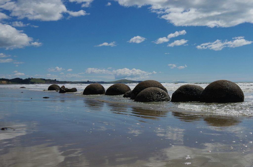 Oamaru New Zealand coast with round boulders on the sand