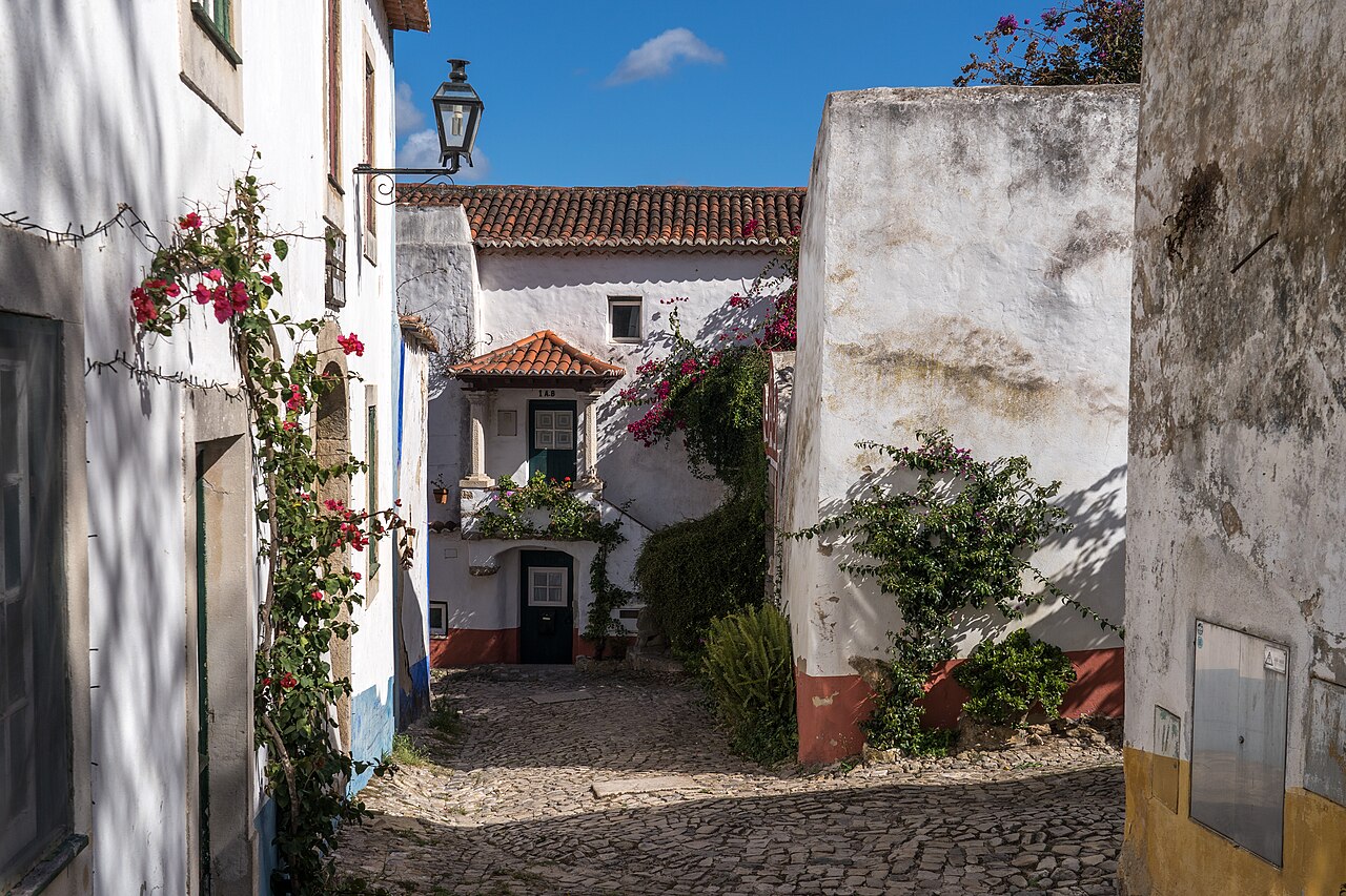 A narrow whitewashed lane in Óbidos old town