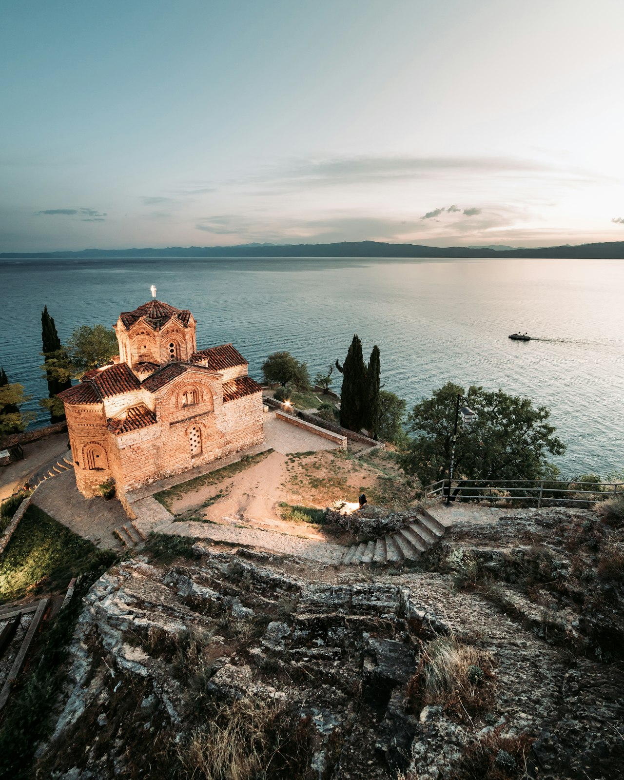 Buildings along the shore of the lake on a sunny day