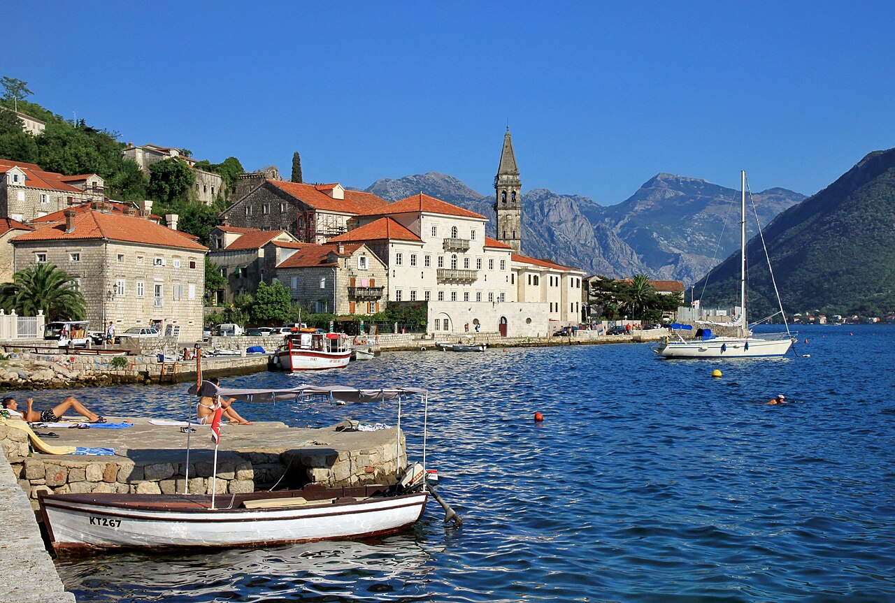 Stone palaces and church tower along the waterfront of Perast in the Bay of Kotor