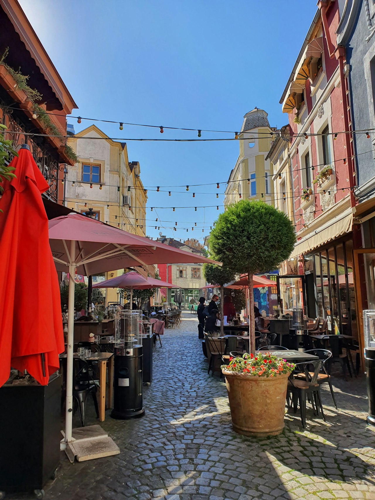Cafe tables on a cobbled street in Plovdiv Bulgaria