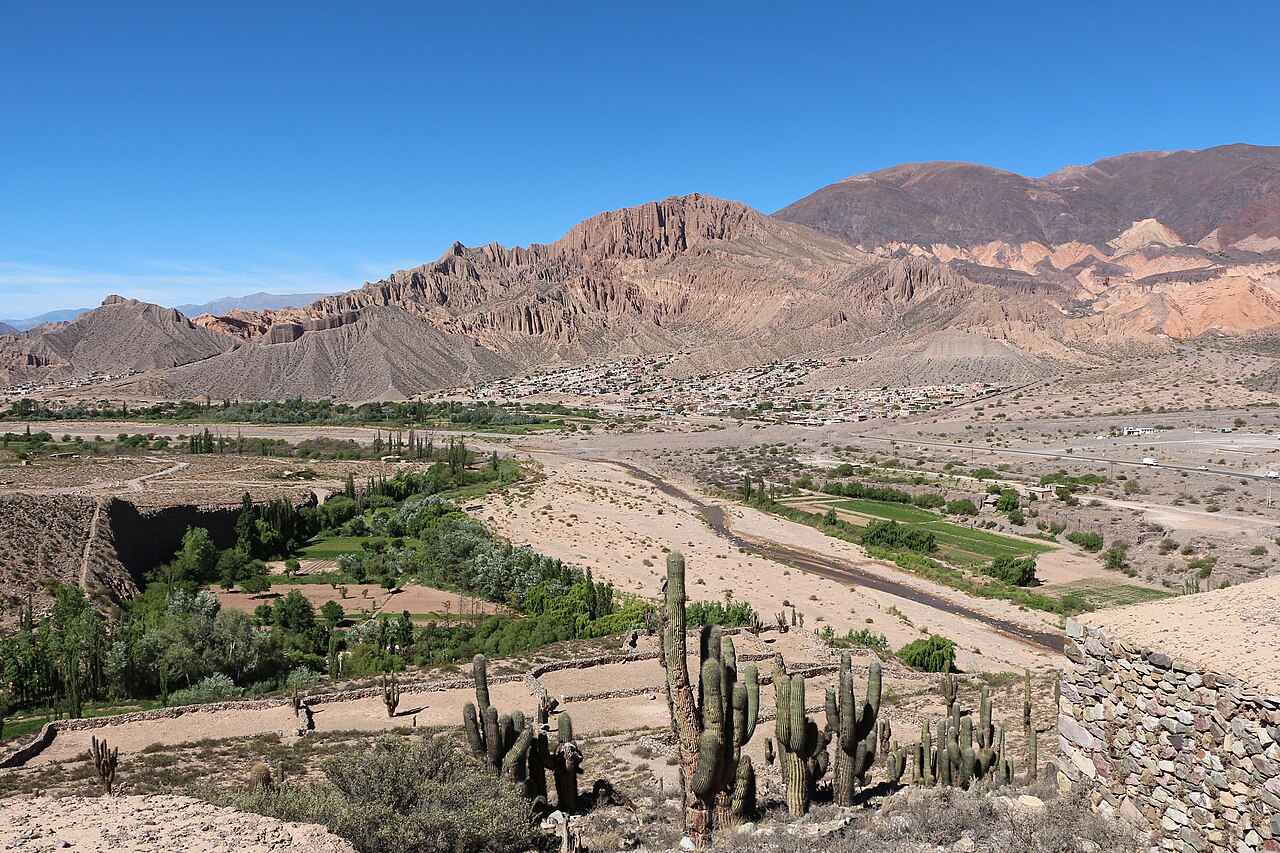 Wide desert valley with colored mountains