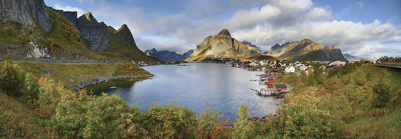 Red fishermen's cabins of Reine Lofoten under steep mountains