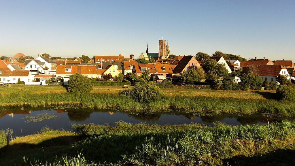 Ribe Denmark old town and cathedral tower seen across the river meadows