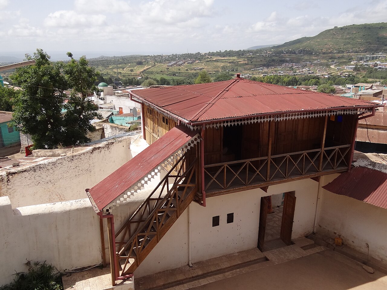 Courtyard of an old house with wooden balconies
