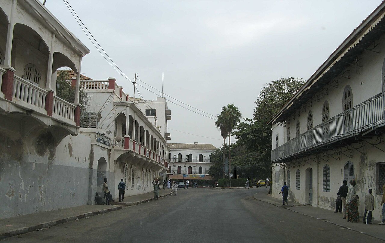Colonial houses with balconies on a street in Saint-Louis Senegal