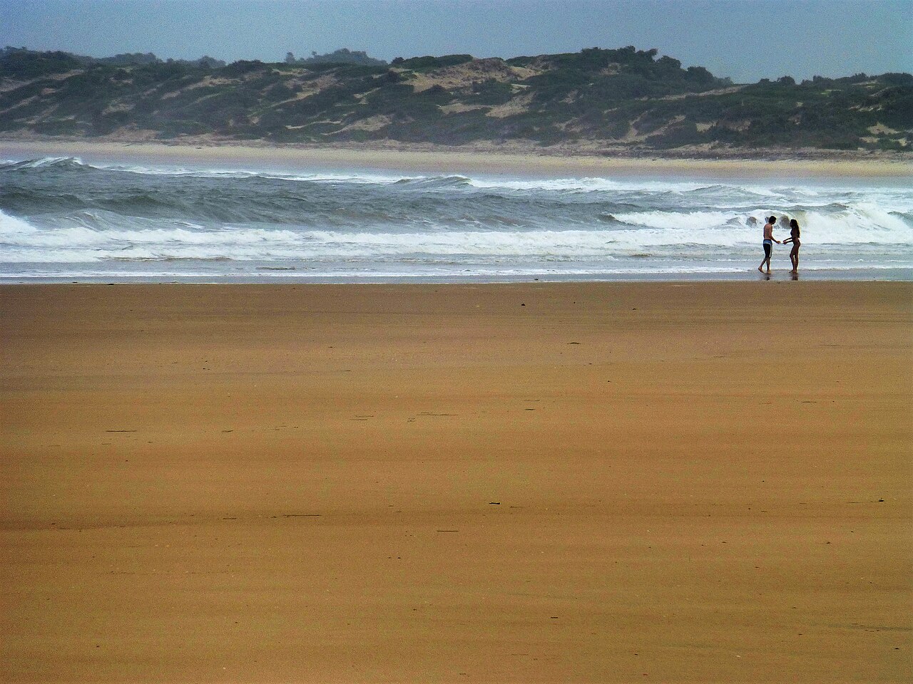 Wide sandy beach and dunes at Shela village