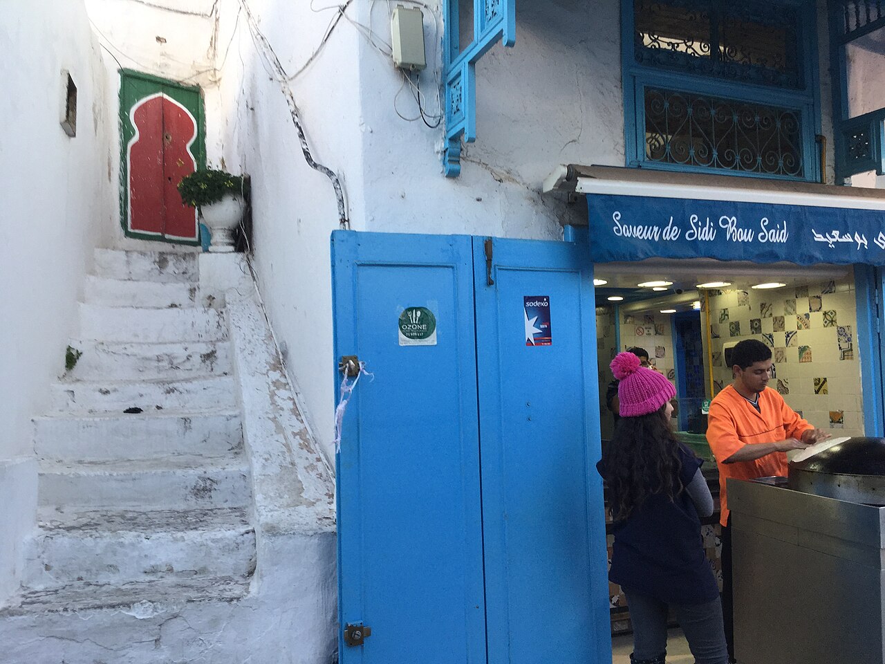 White stairs and bright blue door on a lane in Sidi Bou Said