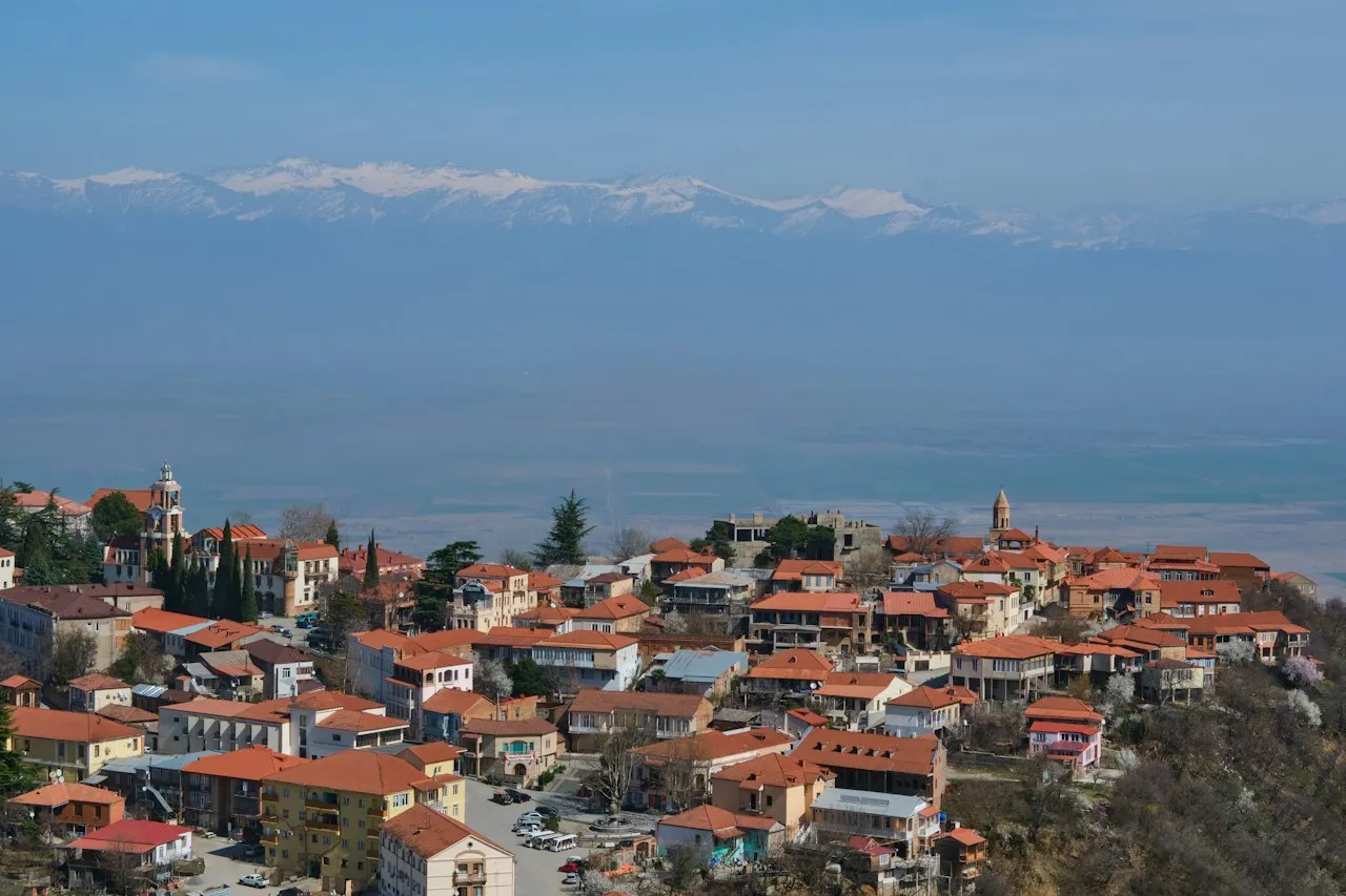 Sighnaghi Georgia hilltop town with mountains behind