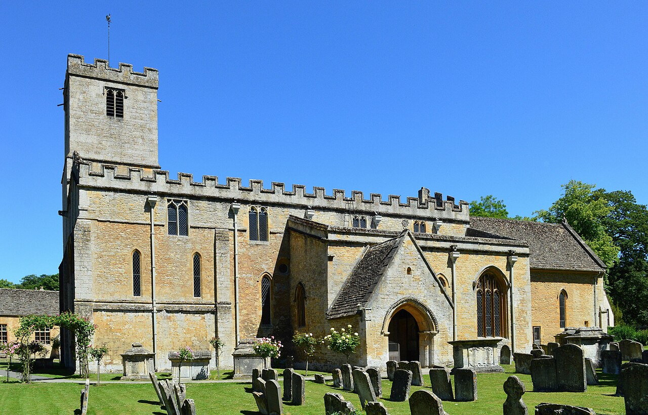 Old stone church of St Mary surrounded by a churchyard