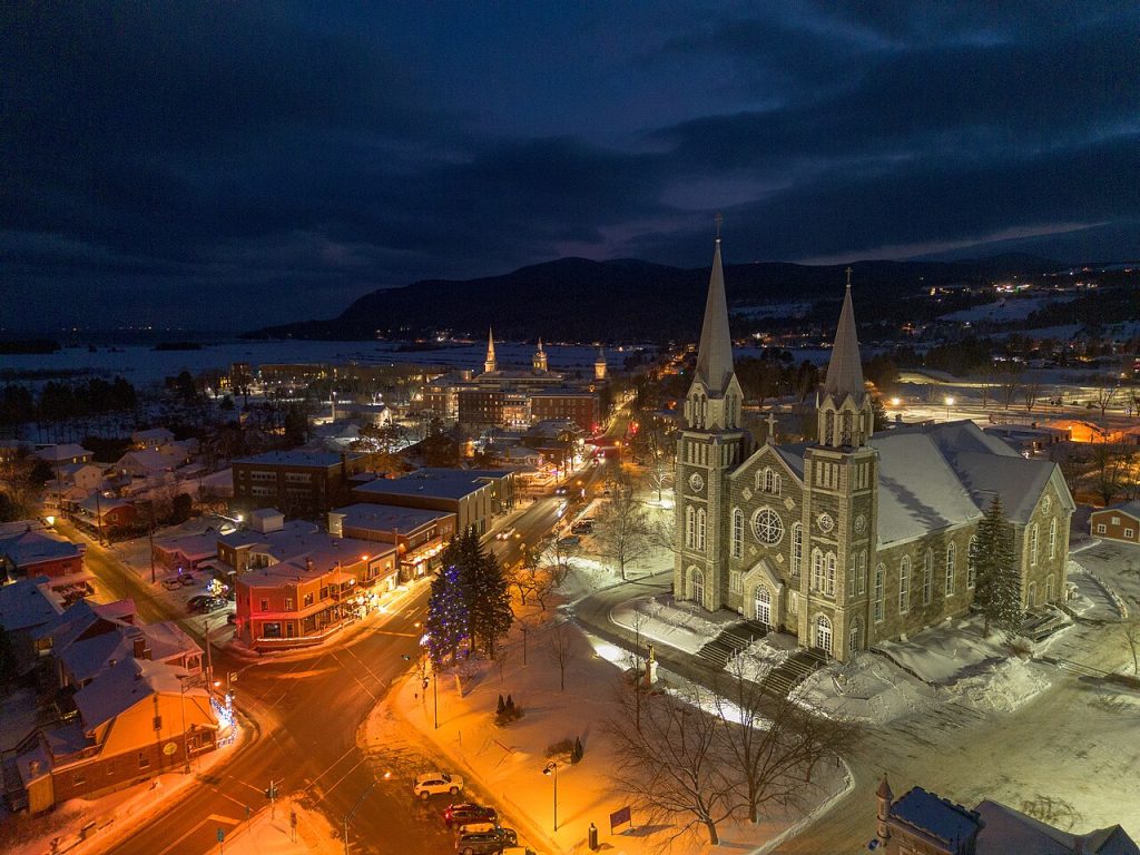 Town lights glowing around the church at night