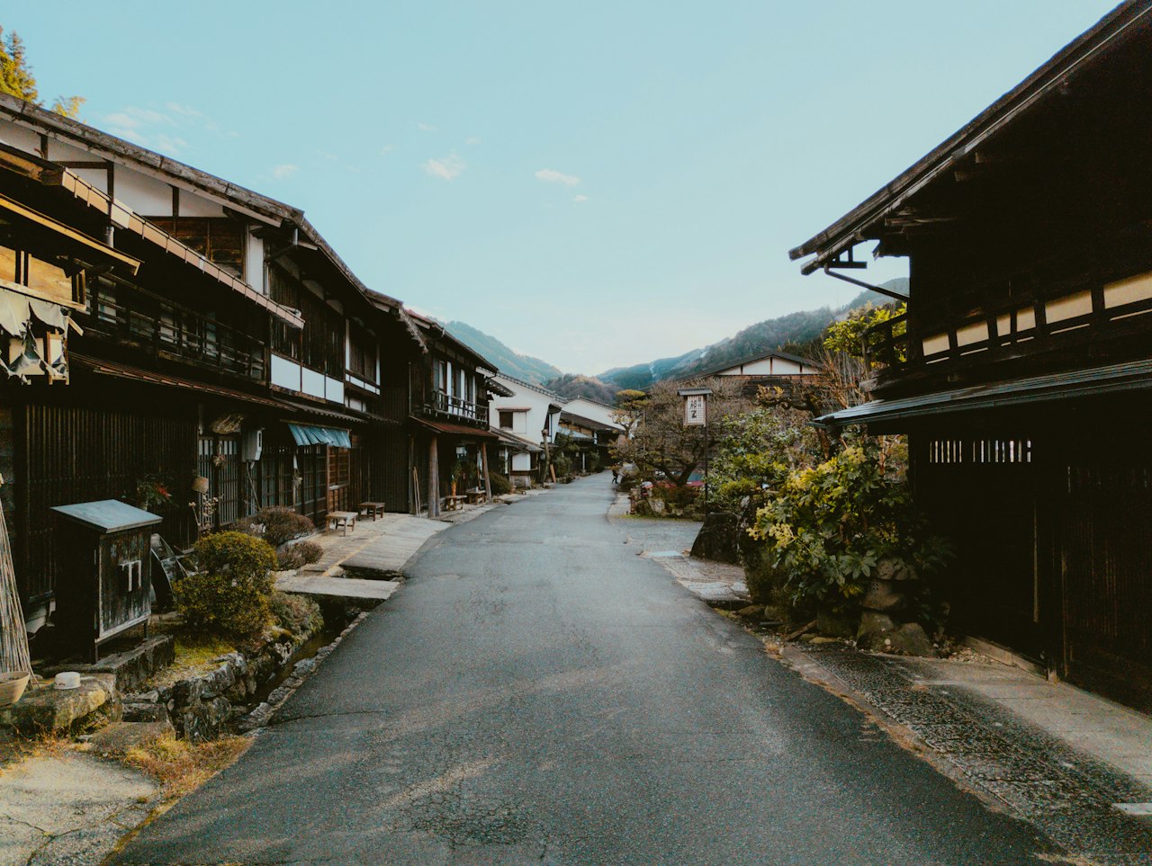 Empty village street with wooden houses