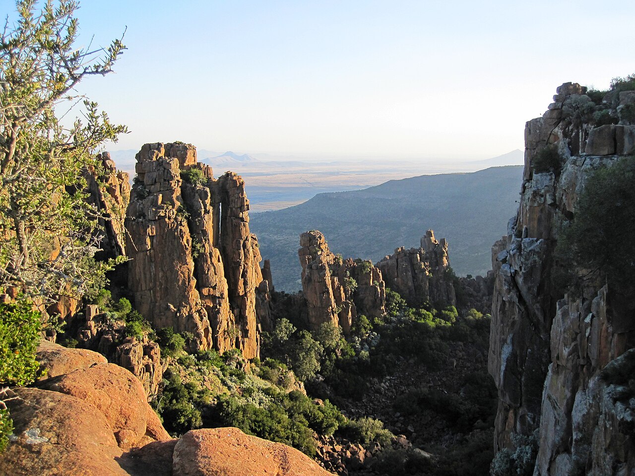 Tall rock columns above a wide valley