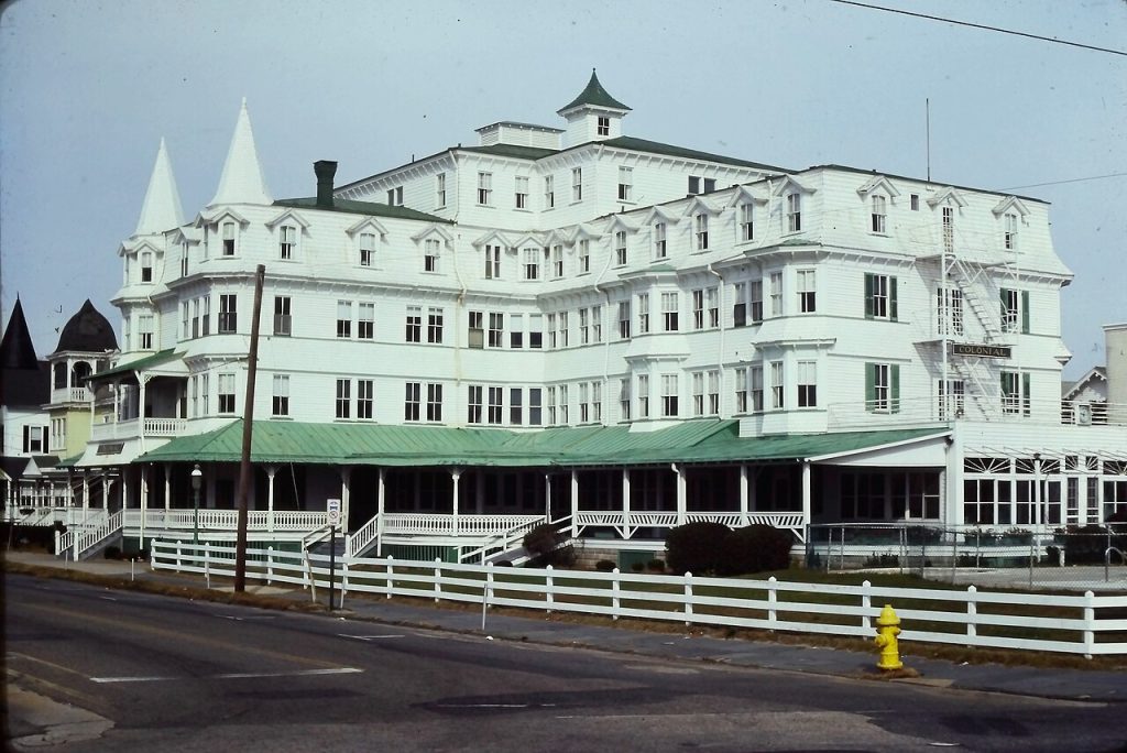 A large Victorian hotel with long porches and gables