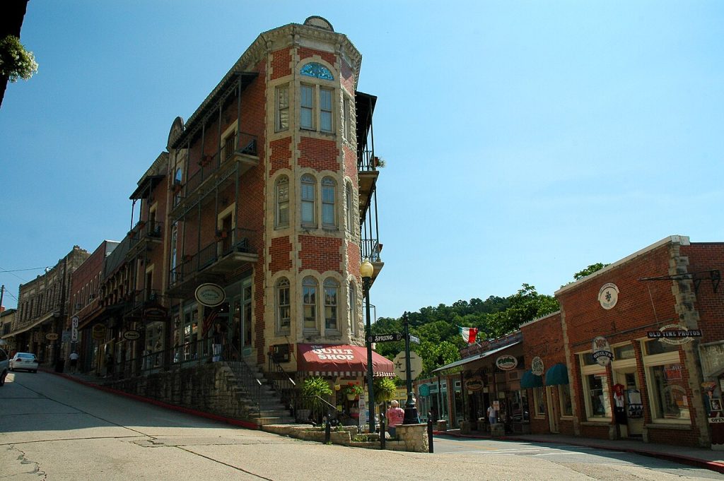 Brick Victorian buildings along a curving downtown street