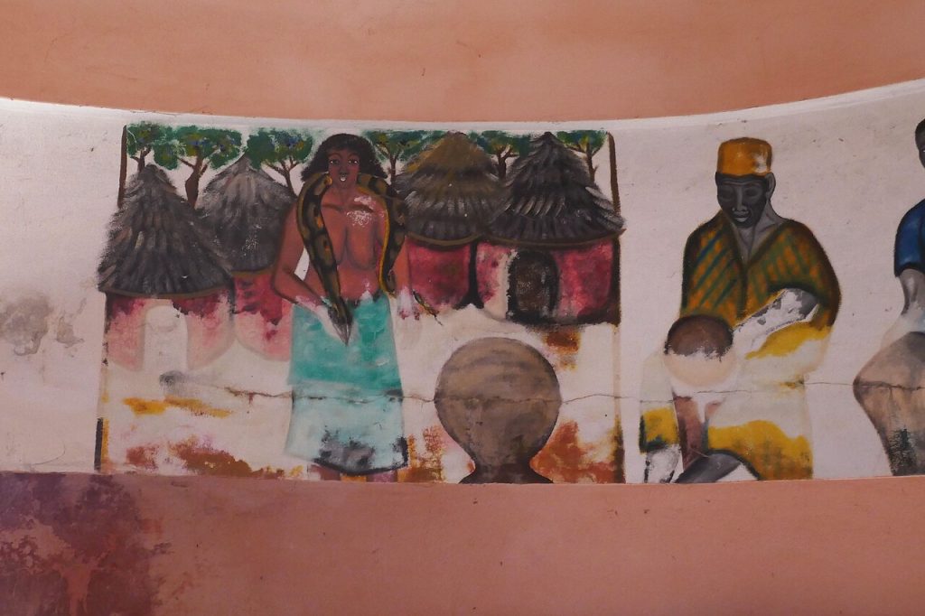 Painted fresco of figures on the wall of a Vodun temple